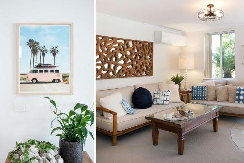 a living room with a couch and a table at Relax at The Sands in Mollymook