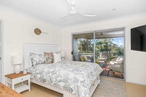 Ένα ή περισσότερα κρεβάτια σε δωμάτιο στο Surfers Beach House