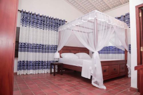 Katil atau katil-katil dalam bilik di Kirala Villa