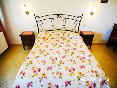 Postel nebo postele na pokoji v ubytování Saturnia Pian Di Cataverna