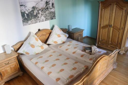 a bedroom with a bed with two pillows on it at Deine-Eifel-Ferienwohnung in Feusdorf