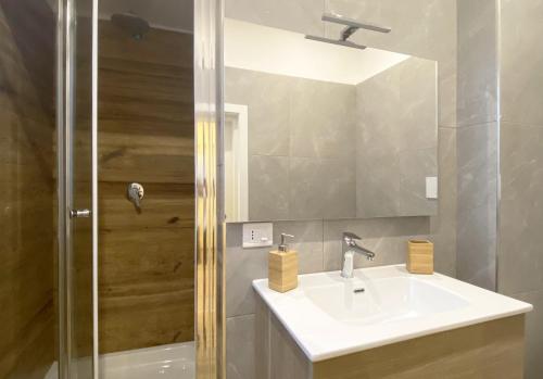 a bathroom with a sink and a shower at Sami B&B and holidays home in Taranto
