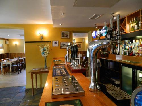 a bar in a pub with a machine at Beambridge Inn in Wellington