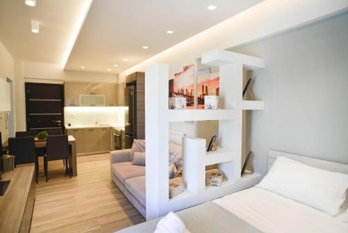a bedroom with a bed and a living room at Luxury Suite With Pool 'by DiCar Properties' in Patra