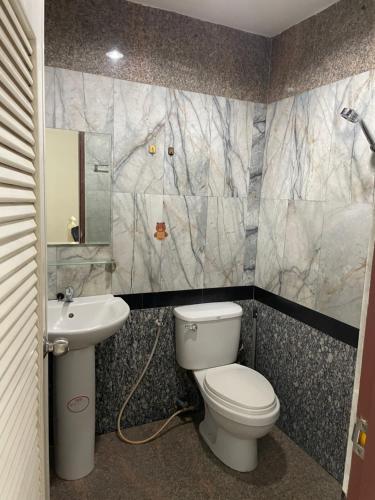 a bathroom with a toilet and a sink at TG2 - Tientong Guesthouse 2 in Hua Hin