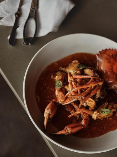 a bowl of food with shrimp in a sauce at Patina Maldives, Fari Islands in North Male Atoll