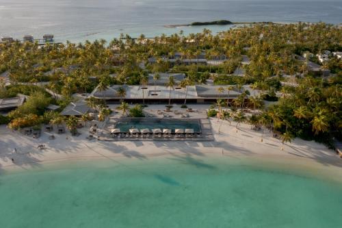an aerial view of a resort on the beach at Patina Maldives, Fari Islands in North Male Atoll