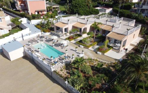 an aerial view of a house with a swimming pool at Small Luxury apartments Pool and sea view - Stella Del Mare in Fontane Bianche