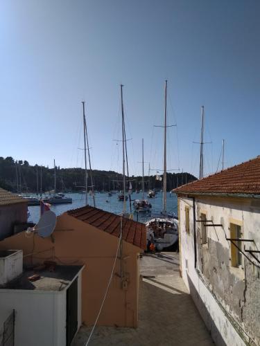 a view of a harbor with boats in the water at Ilios Hotel in Lákka