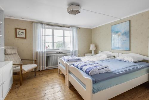 Postel nebo postele na pokoji v ubytování Spacious holiday home in Flattinge, Lagan, 200 m from Lake Flaren