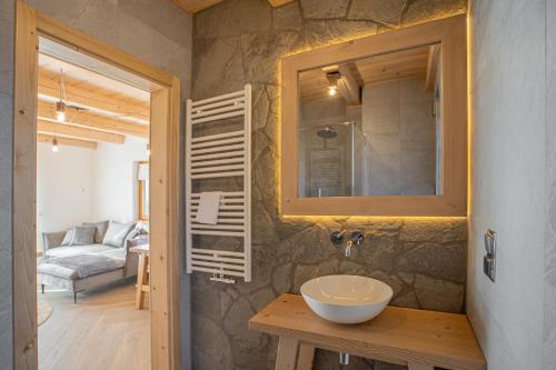 a bathroom with a sink and a mirror at Świerkowa Osada in Istebna