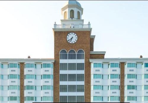 a building with a clock tower on top of it at Garden City Hotel in Garden City