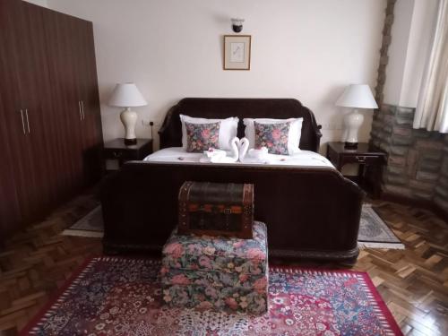 Ένα ή περισσότερα κρεβάτια σε δωμάτιο στο The Drexel House Kenya