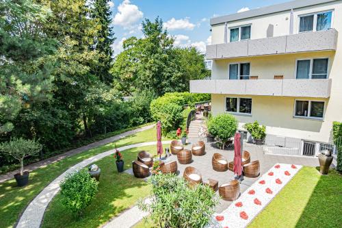 an aerial view of a building with a garden at Parkhotel Sonnenberg in Eltville