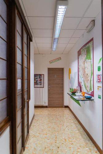 an office hallway with a door and a hallway sidx sidx at Bed & Bike Ferrara in Ferrara