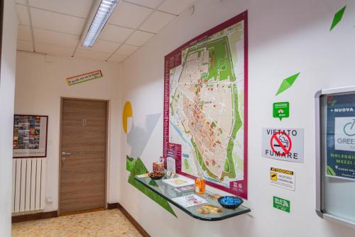 a large map on a wall in a hallway at Bed & Bike Ferrara in Ferrara