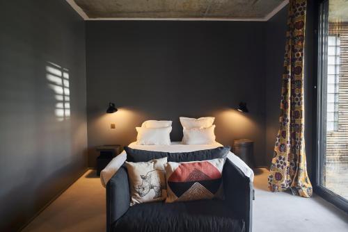 Кровать или кровати в номере Hotel La Zoologie & Spa Bordeaux