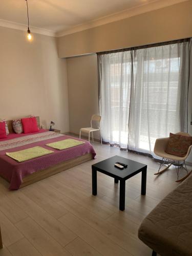 Кровать или кровати в номере Aris Apartment