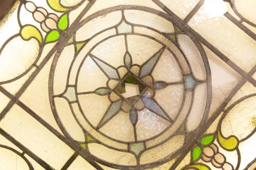 a stained glass window with a cross on it at Granada Apartments Berkeley in Blackpool
