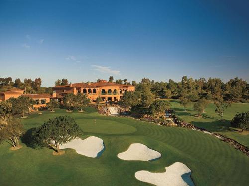 an overhead view of a golf course with two putting greens at Fairmont Grand Del Mar in San Diego