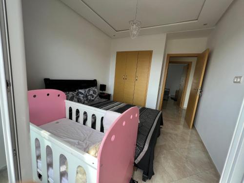 Кровать или кровати в номере Résidence RAMOFLORES - Appartement avec piscine - Sidi Rahal