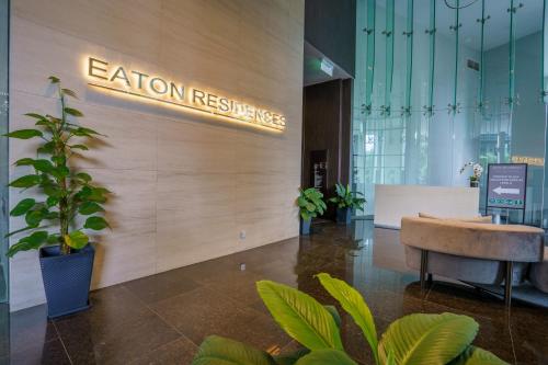 a lobby with a sign that reads echo resistance at Eaton Residence KLCC in Kuala Lumpur