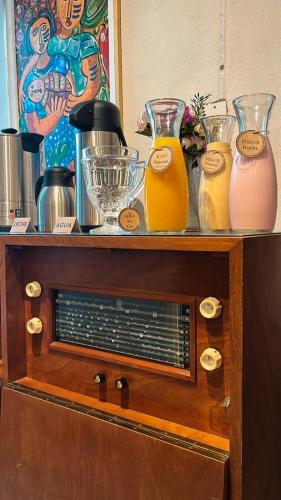 a wooden shelf with differentiatesiatesiatesiatesiatesiatesiatesiatesiatesktop at VIOLETA HOTEL Boutique in Artigas