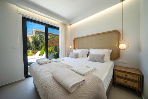 Ένα ή περισσότερα κρεβάτια σε δωμάτιο στο Villa Olira