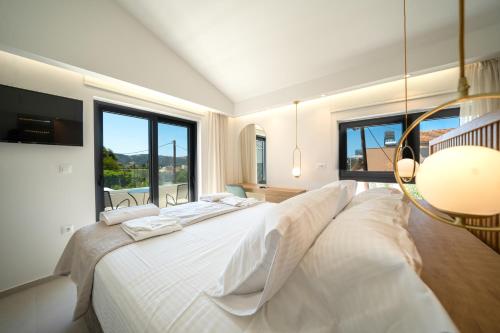 Ένα ή περισσότερα κρεβάτια σε δωμάτιο στο Villa Olira