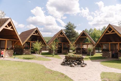 a group of log homes with a courtyard at Recreation complex Volnogora in Lisarnya