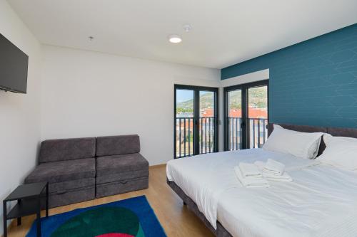 Ένα ή περισσότερα κρεβάτια σε δωμάτιο στο DOMINIUM CITY SUITES