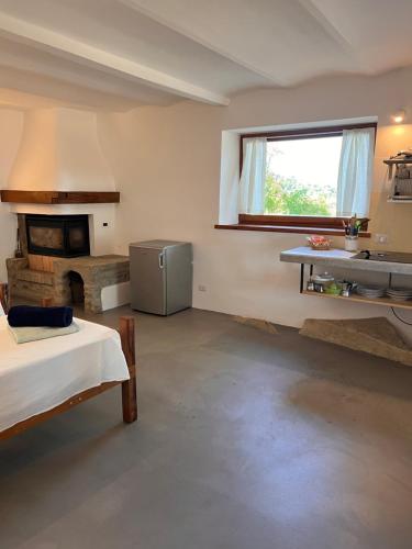 a room with a room with a fireplace and a table at Agriturismo Sanventura in Città di Castello