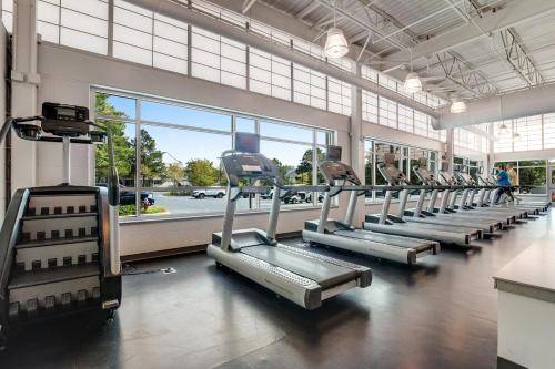 a gym with rows of treadmills in a building at Sea Colony - 1804 Doubles in Bethany Beach
