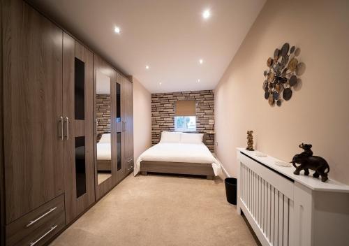 a small bedroom with a bed and a window at The Hideaway Sherburn in Elmet in Sherburn in Elmet