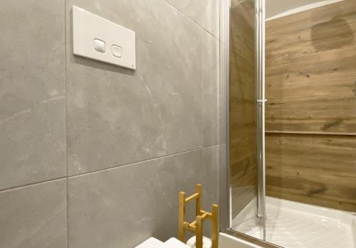 a bathroom with a shower with a glass door at Sami B&B and holidays home in Taranto