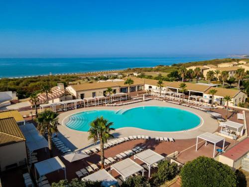 an overhead view of a swimming pool at a resort at Sikania Resort & Spa in Licata