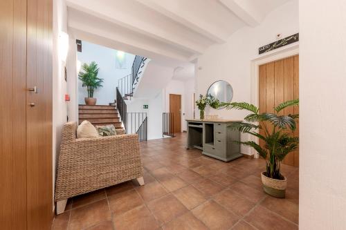 a living room with a chair and a table at Hotel La Sitja - Adults only in Benisoda