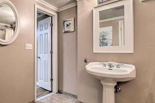 a bathroom with a sink and a mirror at Bel Air Apartment with Pool about 2 Mi to Main St in Bel Air