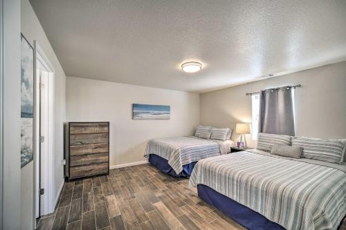 a bedroom with two beds and a dresser in it at Welcoming Carlsbad Home Near Parks and Town! in Carlsbad