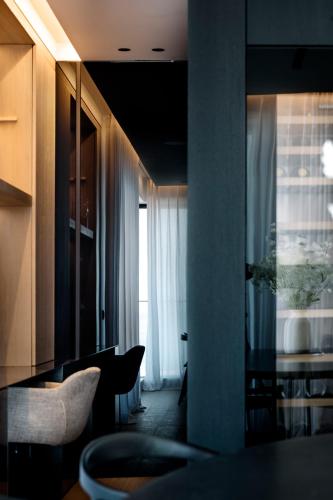 a kitchen with a table and a dining room at appartement sea view in Ostend