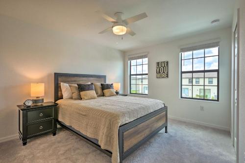 a bedroom with a bed and a ceiling fan at Brand New Fort Myers Townhome Community Pool in Fort Myers