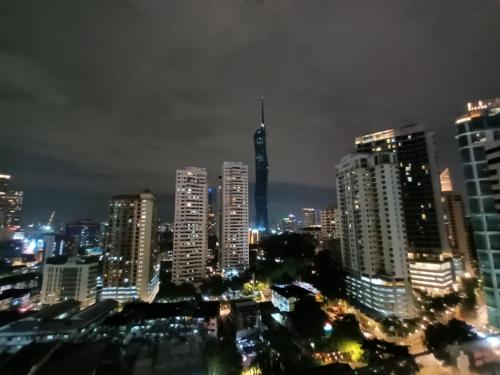 a view of a city at night with buildings at City Home Suites Kuala Lumpur City Centre in Kuala Lumpur