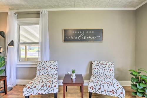 a living room with two chairs and a table at Cozy Cottage Near Dtwn Dining, Walk to Casino in Bristol