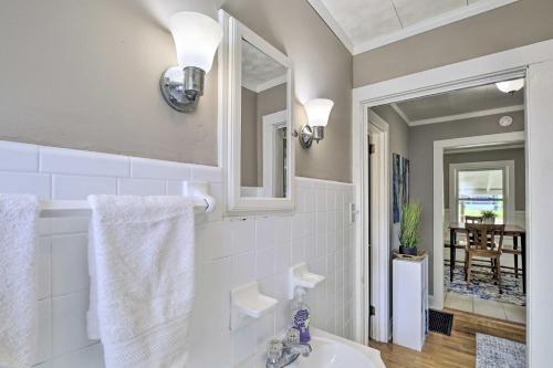 a bathroom with a sink and a mirror at Cozy Cottage Near Dtwn Dining, Walk to Casino in Bristol