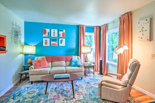 a living room with a couch and a table at Modern Rapid City Duplex Less Than 10 Mi to Natl Forest! in Rapid City