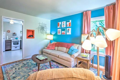 a living room with blue walls and a couch at Modern Rapid City Duplex Less Than 10 Mi to Natl Forest! in Rapid City