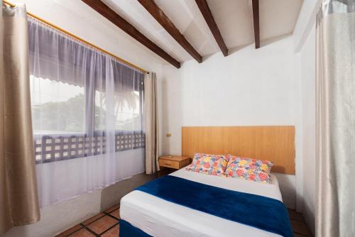 Postel nebo postele na pokoji v ubytování Hostal North Seymour