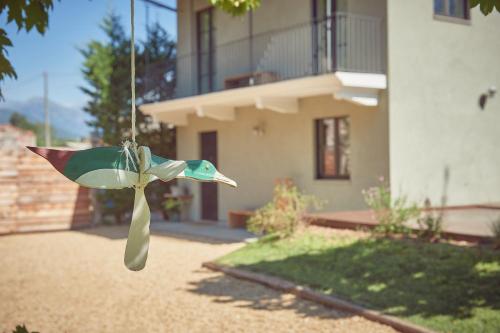 a bird feeder in front of a house at AQVAE Unconventional Country House in Oglianico