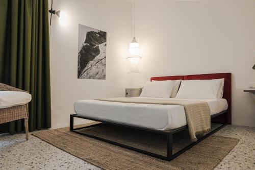 Ένα ή περισσότερα κρεβάτια σε δωμάτιο στο Hotel Dolomiti