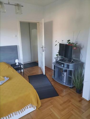 Postel nebo postele na pokoji v ubytování W Apartman